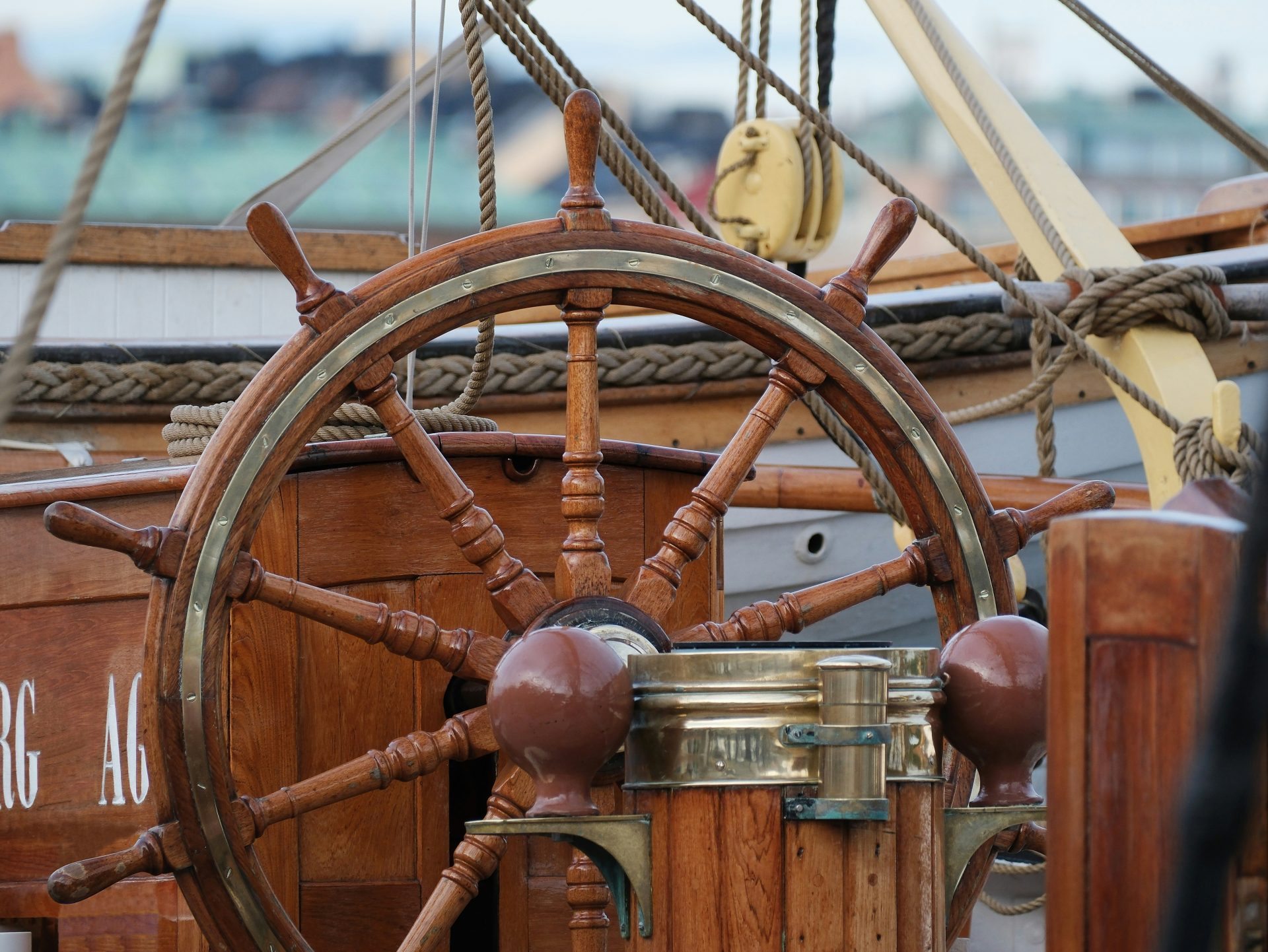 A close up of a steering wheel on a boat